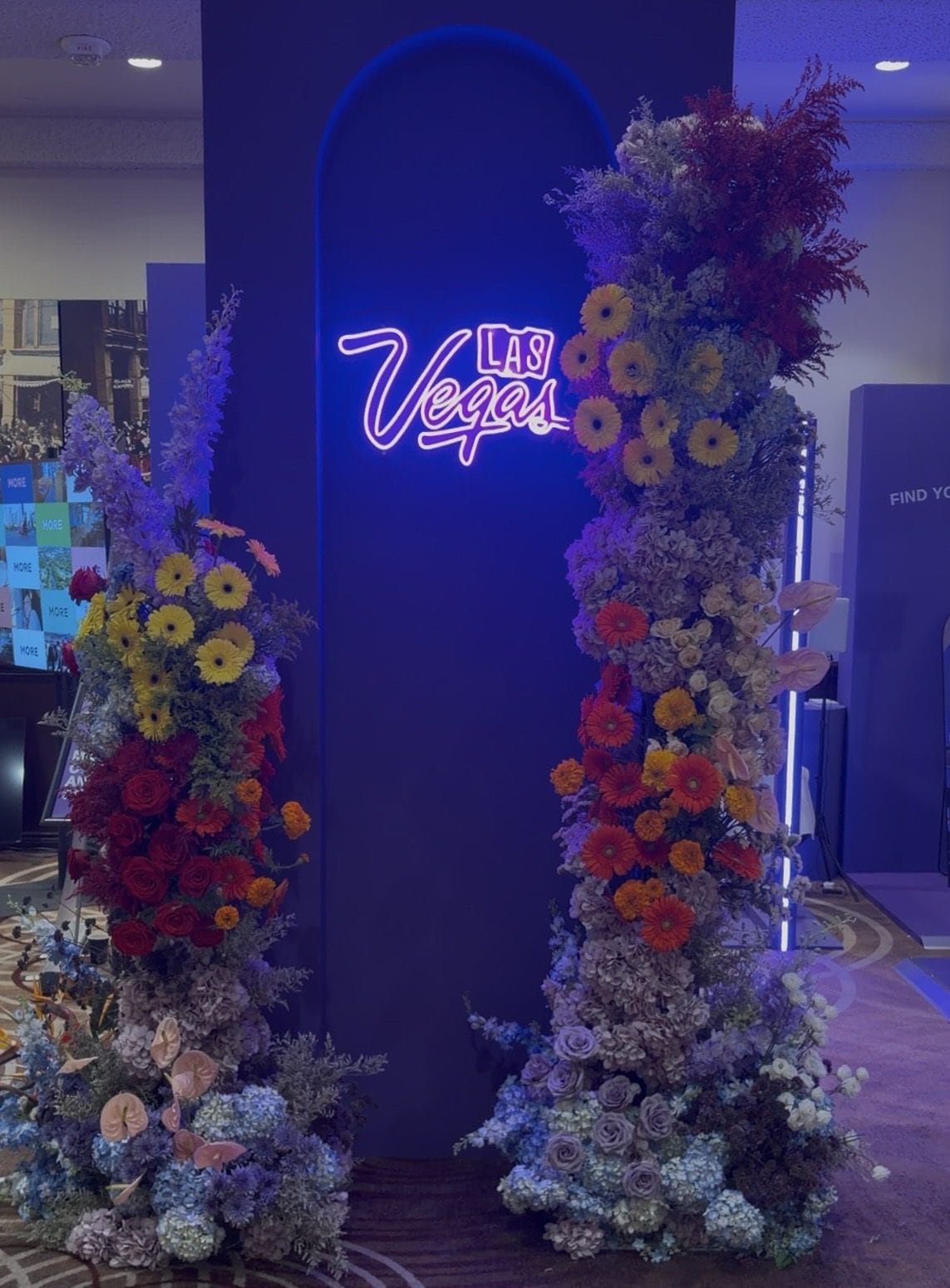 Floral and neon set design detail for the Las Vegas Convention and Visitors Authority activation